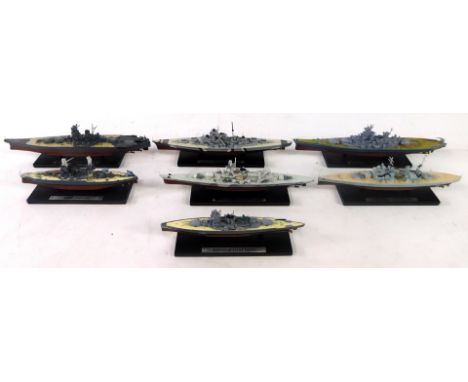 Seven scale models of battleships, on stands, with blister packs, comprising Admiral Graf Spee., USS Arizona., Scharnhorst., 