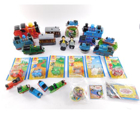 Thomas The Tank Engine collectables, including clockwork trains, bubble bath trains, batteries, Fat Controller figure and Tom