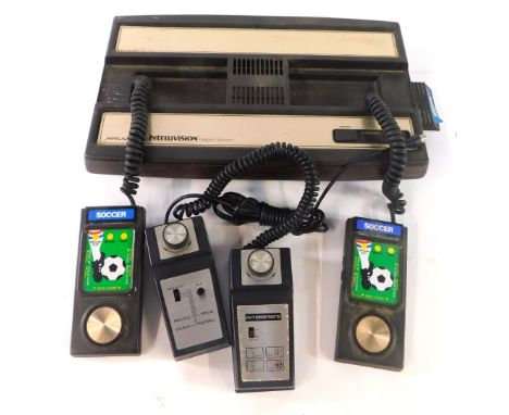 A Mattel Electronics Intelllivision Soccer Game, with games select controllers for Interstate, Practice Tennis, Squash and Fo