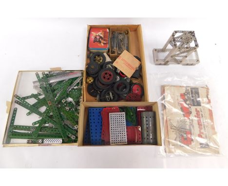 Meccano, including wheels, rods, engineering manual and a steel construction set illustration book. (a quantity)