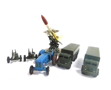 A pair of Dinky Toys die cast 10 ton army trucks, pair of 5.5 medium guns, military rocket launcher on a rotating base, rocke