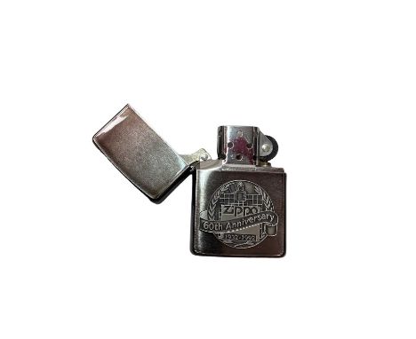 Zippo 60th anniversary lighter in original boxGood condition, sparks when trying to work it but it hasn't got any lighter flu