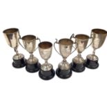 Six silver tennis related trophies on stands and four plated (10)