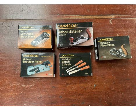 Five Veritas miniature tools to include miniature shoulder plane, bench chisels, bench plane, plow plane, and a low-angle blo