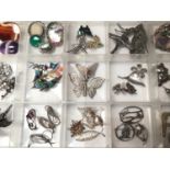Collection of silver and white metal brooches including filigree, gem set, enamelled etc