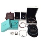 Pandora 'Moments' silver charm bracelet with various charms, Pandora leather bracelet, three Pandora