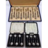 Two cased sets of six silver bean end coffee spoons and a set of twelve Italian silver (800) handled