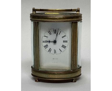 Two antique brass cased carriage clocksThe oval clock is 12cm high, not working and lacking key,The square clock is 10.5cm hi