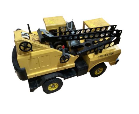 Selection of Tonka toy lorries, car transporter, Tri-ang Minic lorry and other unboxed vehicles.
