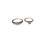 9ct gold diamond three stone ring, weighing 0.25cts in total, in a white gold rub over setting, size