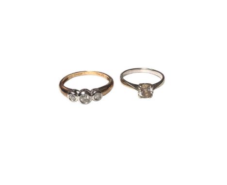 9ct gold diamond three stone ring, weighing 0.25cts in total, in a white gold rub over setting, size O½ and a 9ct gold cubic 