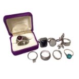 Group of silver and white metal dress rings