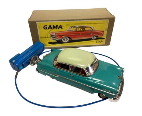 Gama made in Western Germany, remote controlled Kapitan tinplate vehicle in original box. plus an unboxed Triang minic garage