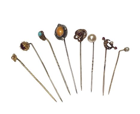 Eight antique stick pins to include a Victorian 15ct gold ruby and seed pearl crescent moon pin15ct gold pin weighs 1.1 grams