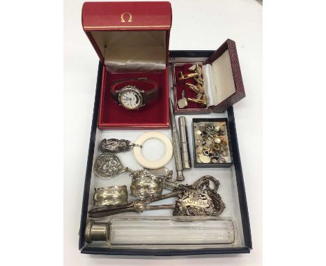 Omega watch box, Casio wristwatch, various cufflinks and studs, silver identity bracelet, silver kitten rattle/ teether and s