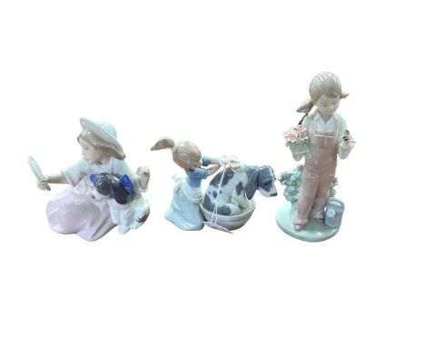 Group of Lladro figures including children with dogs (6) plus a Nao figure