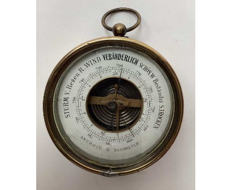 Antique German brass cased aneroid barometer, 10cm diameter