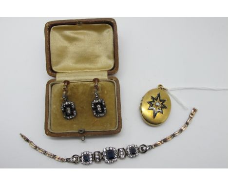 A XIX Century Oval Locket Pendant, single pearl set to the centre, within stylised star highlighted in black enamel (inside o