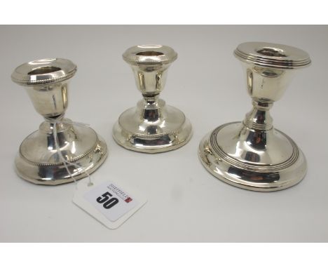 A Pair of Hallmarked Silver Dwarf Candlesticks, Birmingham 1924, (dents), each on circular spreading base (bases weighted) 7.