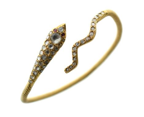 Gold coloured metal serpent design diamond set bangle, bearing indistinct marks   Condition: 