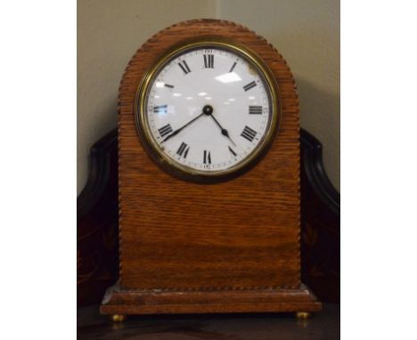 Early 20th Century inlaid oak arch shaped mantel clock, the white enamel dial with Roman numerals   Condition: 