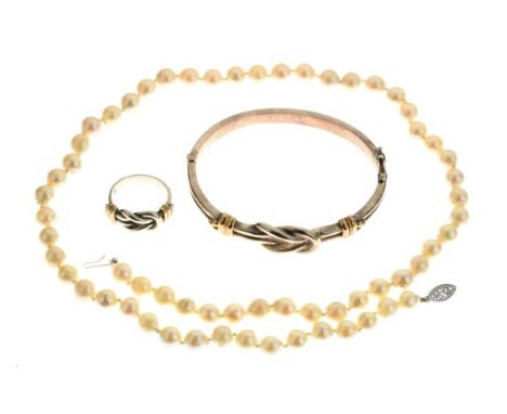 Reef knot design snap bangle and en-suite ring, stamped 925, together with a string of pearls   Condition: 