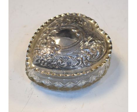 Edward VII cut glass heart shaped trinket box, the embossed silver cover with stylised foliate decoration and hallmarked for 