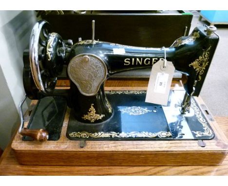 Early 20th Century Singer sewing machine (lacking cover) together with a rectangular folding garden occasional table   Condit