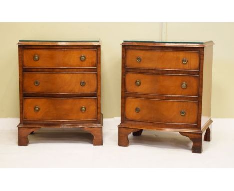 Pair of reproduction mahogany serpentine front chests, each fitted three drawers and standing on bracket feet   Condition: 