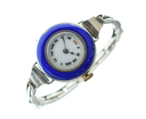 Blue enamel cased wristwatch, the white enamel dial with Roman numerals   Condition: 