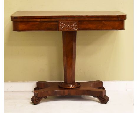Victorian mahogany rectangular top fold over card table standing on a tapered octagonal pillar and quadripartite base with ca