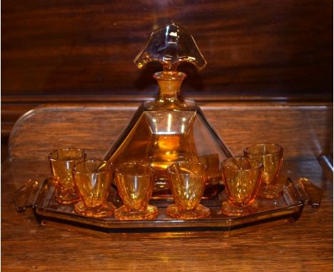 Art Deco style amber glass liqueur set comprising: decanter and stopper, four glasses and a tray   Condition: 