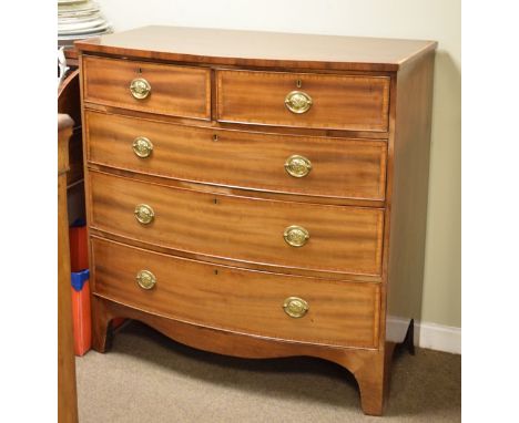 George III satinwood crossbanded mahogany bowfront chest, the handles with Prince of Wales feathers in relief and standing on