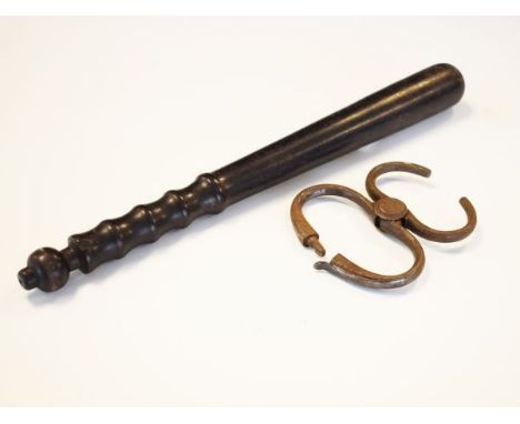 Vintage hardwood police truncheon, together with a pair of steel handcuffs   Condition: 