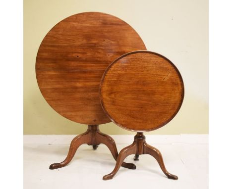 George III mahogany circular snap top supper table on a baluster turned pillar and tripod base, together with a similar dish 