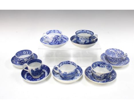 A collection of early 19th century blue and white transfer printed pearlware cups and saucers to include Wedgwood and others 