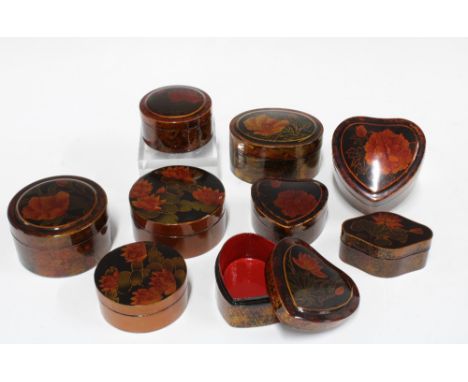 Collection of lacquered papier mache trinket boxes painted with flowers, largest 8.5 x 5cm (9)