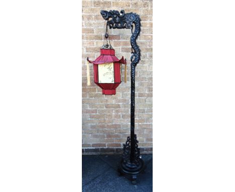 A CHINESE CARVED HARDWOOD STANDARD LAMP  with silk shade