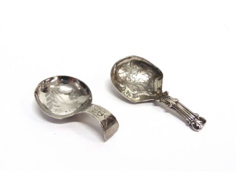 A GEORGIAN SILVER CADDY SPOON  by Joseph Wilmore, Birmingham 1812, with prick dot decoration; with a Victorian silver caddy s