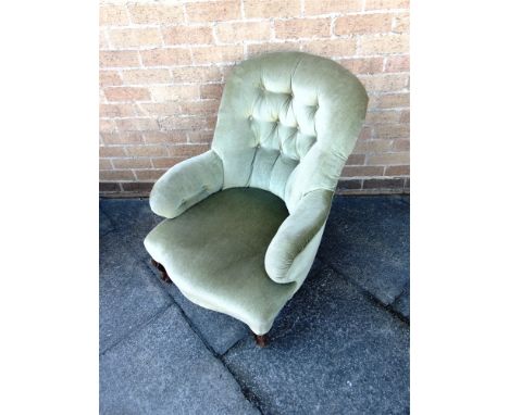 A BUTTON UPHOLSTERED NURSING CHAIR  with serpentine front seat on carved cabriole supports
