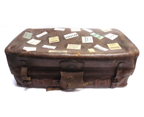 A LEATHER TRAVEL CASE  by Bick Bros., portmanteau and trunk makers, Cheltenham, late 19th or early 20th century, with an inte