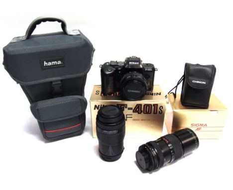 A NIKON F-401S AF CAMERA  with a Sigma Zoom Master 1:3,5-4,5 f=35-70mm lens; together with a Sigma UC Zoom 1:4-5,6 f=70-210mm