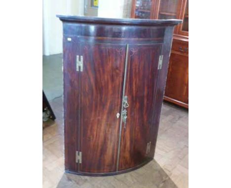 George III mahogany and inlaid bow-fronted corner cupboard with H brass hinges. Condition report: see terms and conditions