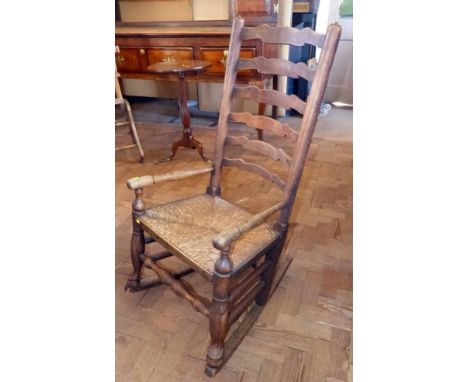 Elm Lancashire ladder-back rocking chair. Condition report: see terms and conditions