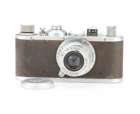 A Leica Model E 35mm Rangefinder Camera, chrome, serial no. 154855, body G, shutter working but sticks on slow speeds, with a