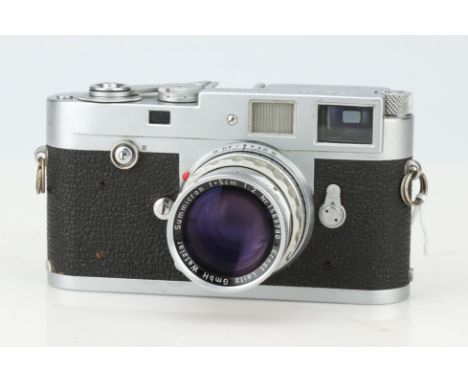 A Leica M2 35mm Rangefinder Camera, chrome, serial no. 944338, body G, shutter working, RF patch &amp; lines are bright &amp;