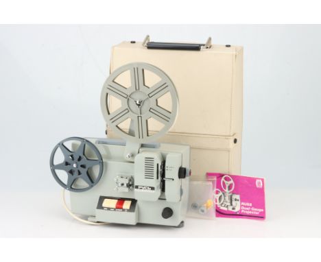 A Russ Dual Guage Projector, possibly soviet, with Cryllic nameplate, toether with two take-up spools &amp; instructions,