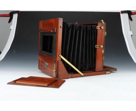 An Unmarked Mahogany &amp; Brass Whole Plate Tailboard Camera, body, F, some repairs, with grafted on lens panel made by John