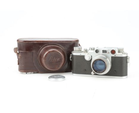 A Leica IIIc 35mm Rangefinder Camera, chrome, serial no. 411286, body G, shutter working, with a Leitz Summar 50mm f/2 lens, 