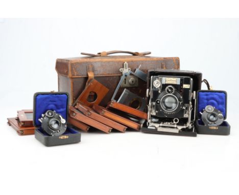 A Sanderson Hand &amp; Stand Plate Camera Outfit, late model c.1928, black leather-bound, body G, serial no. D22869, some lig